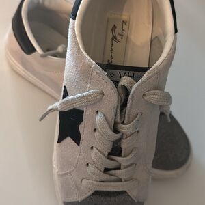 Women’s White and Black Star Sneakers